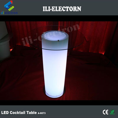 Mesa de cóctel de vidrio LED, iluminada con cubos de hielo.