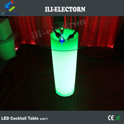Mesa de cóctel de vidrio LED, iluminada con cubos de hielo.