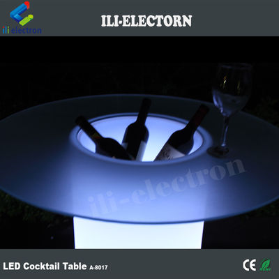Mesa de cóctel de vidrio LED, iluminada con cubos de hielo.